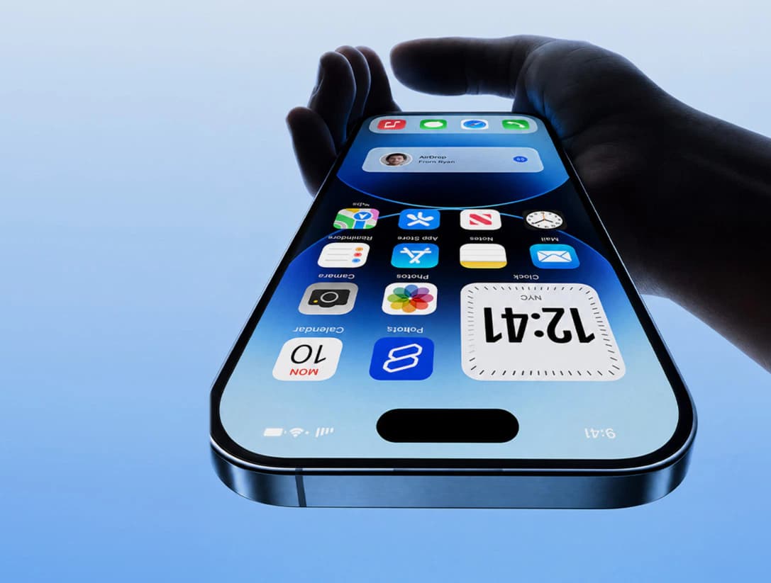 Hand holding modern smartphone with app design